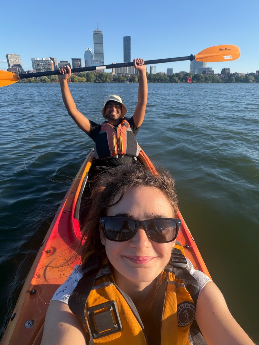 Kayaking on the Charles River with the Boston skyline behind.