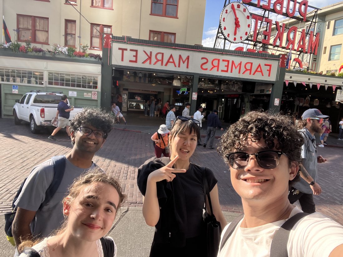 Outside the Pike Place Market sign with friends.