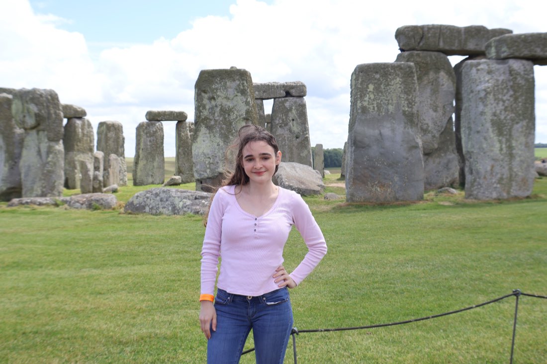 In front of the standing stones at Stonehenge.